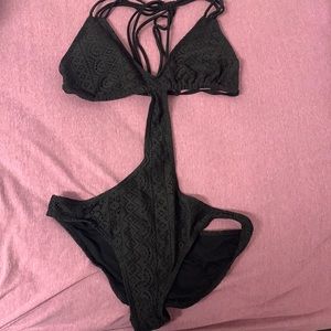 Woman’s black one-piece. Size Large.